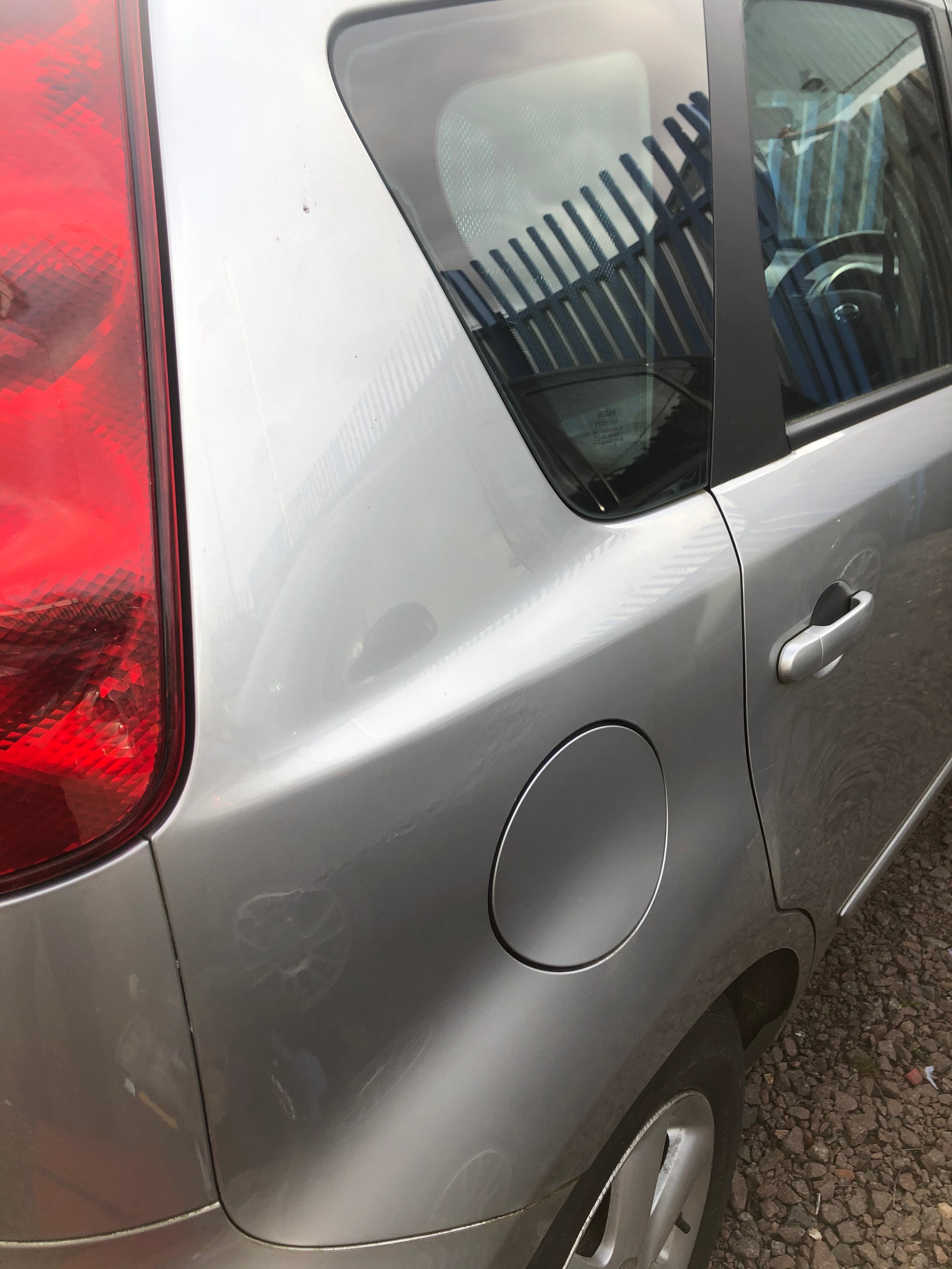 Car panel after paintless dent repair — flawless finish